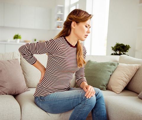 Woman Suffering from Back Pain — Dodge City, KS — Phillips Chiropractic & Physical Therapy Center