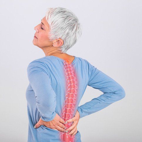 Woman Suffering From Lower Back Pain — Dodge City, KS — Phillips Chiropractic & Physical Therapy Center