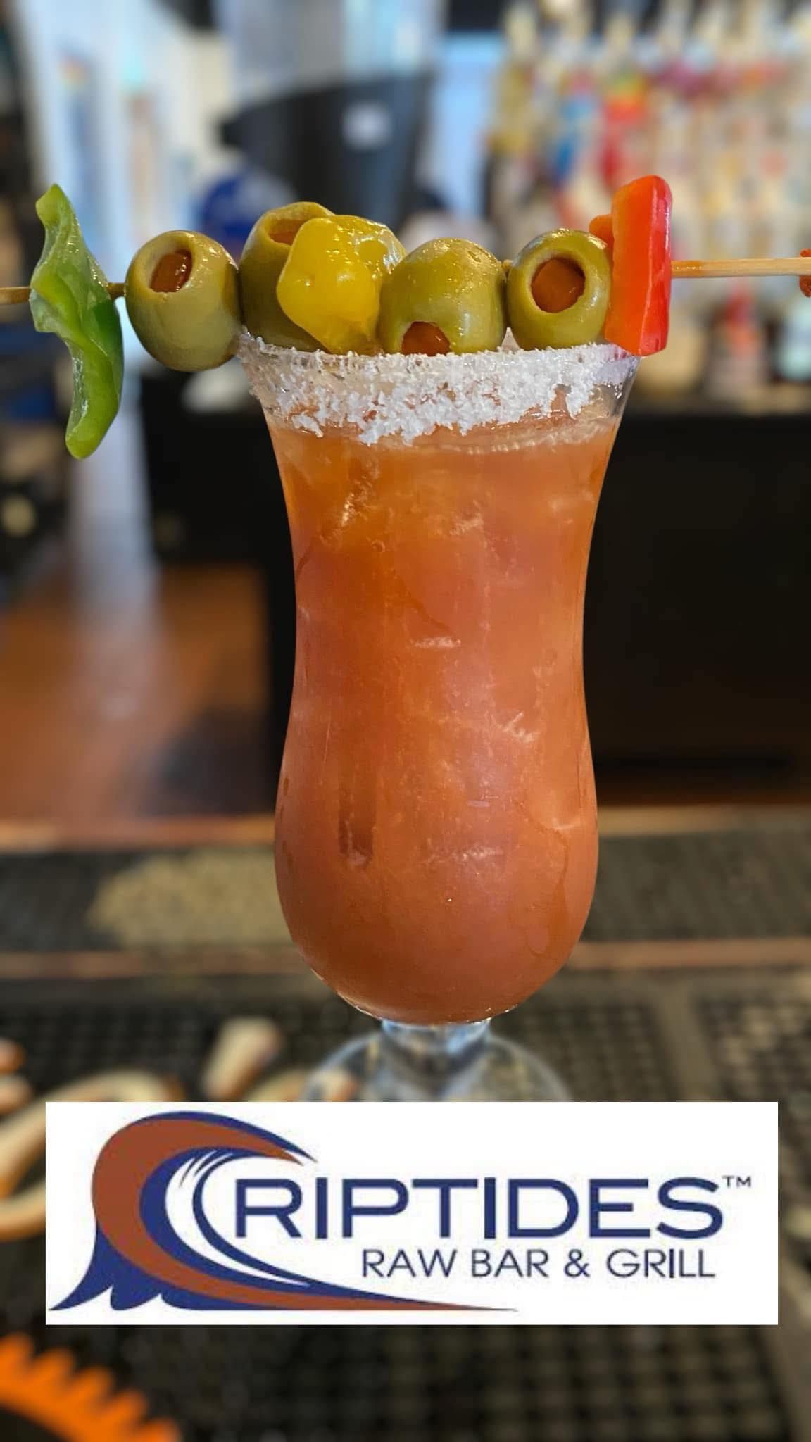 Bloody Mary cocktail, olives and pepper garnish, at Riptides Raw Bar & Grill.