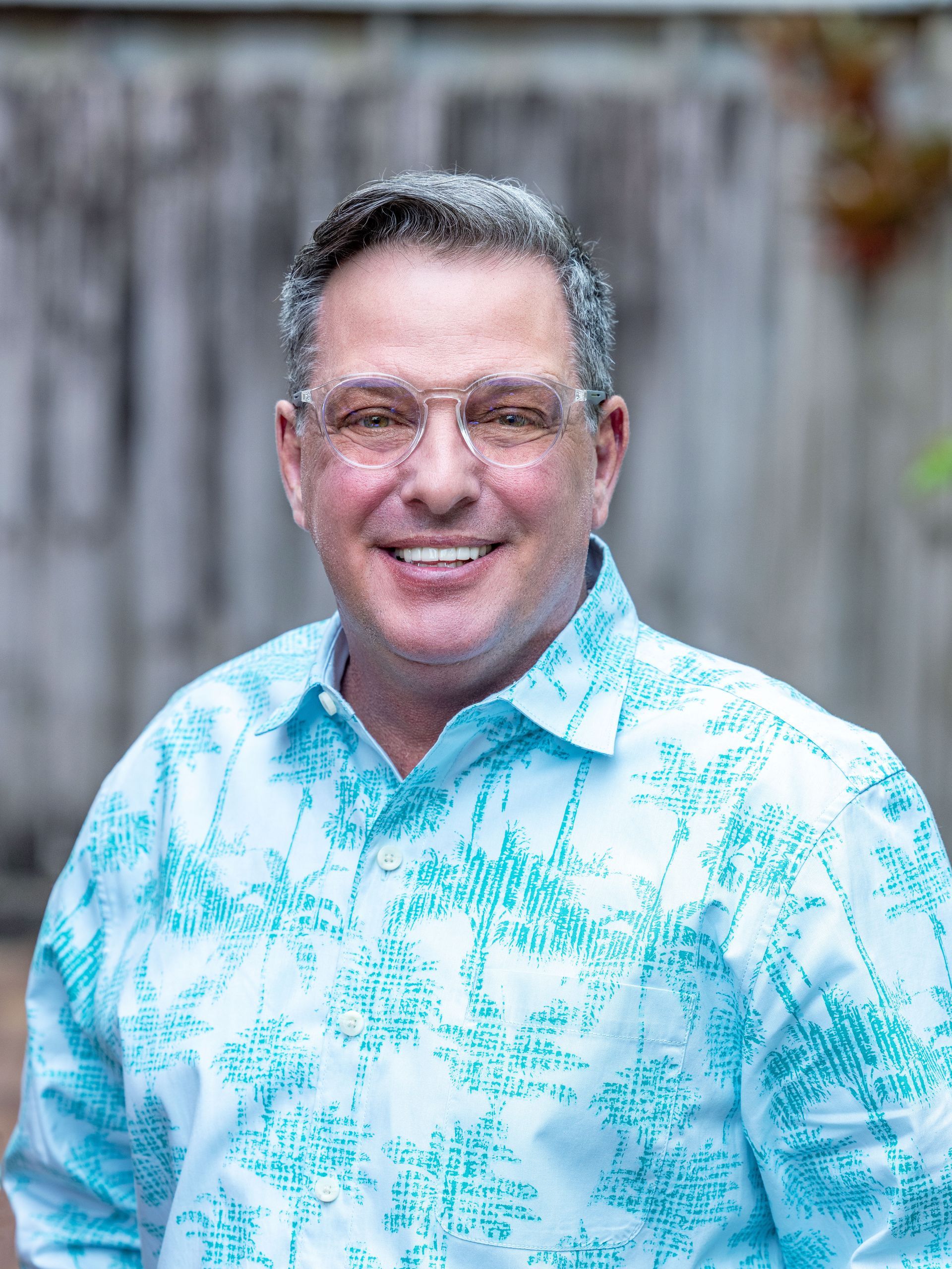 Doctor’s hands on patient’s hands, offering comfort. Warm tones, supportive gesture, indoors.