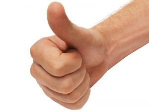 Hand giving a thumbs-up gesture on a white background