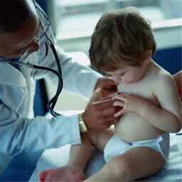 Pediatrician performing a well checkup on little boy Rancho Cucamonga Ca