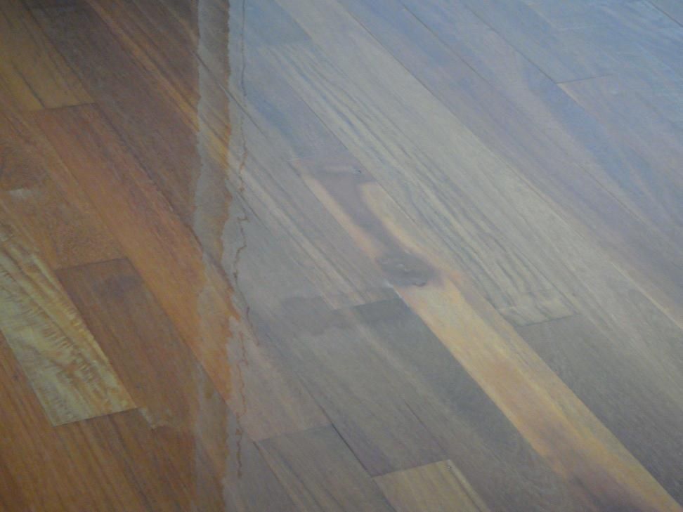 A Close Up Of A Wooden Floor With A Stain On It — AJ's Cleaning & Floor Sanding In Woree, QLD