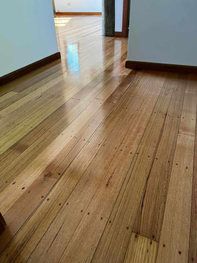 A Close Up Of A Wooden Floor In A Room — AJ's Cleaning & Floor Sanding In Woree, QLD