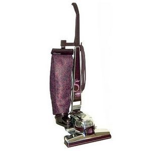 A purple vacuum cleaner is sitting on a white surface. A purple vacuum cleaner is sitting on a white surface.