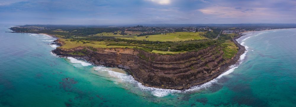 An Aerial View of a Small Island in the Middle of the Ocean — Clarence Property Consultants In Wooli, NSW