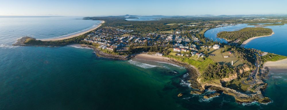 An Aerial View of a Small Island in the Middle of the Ocean — Clarence Property Consultants In Yamba, NSW