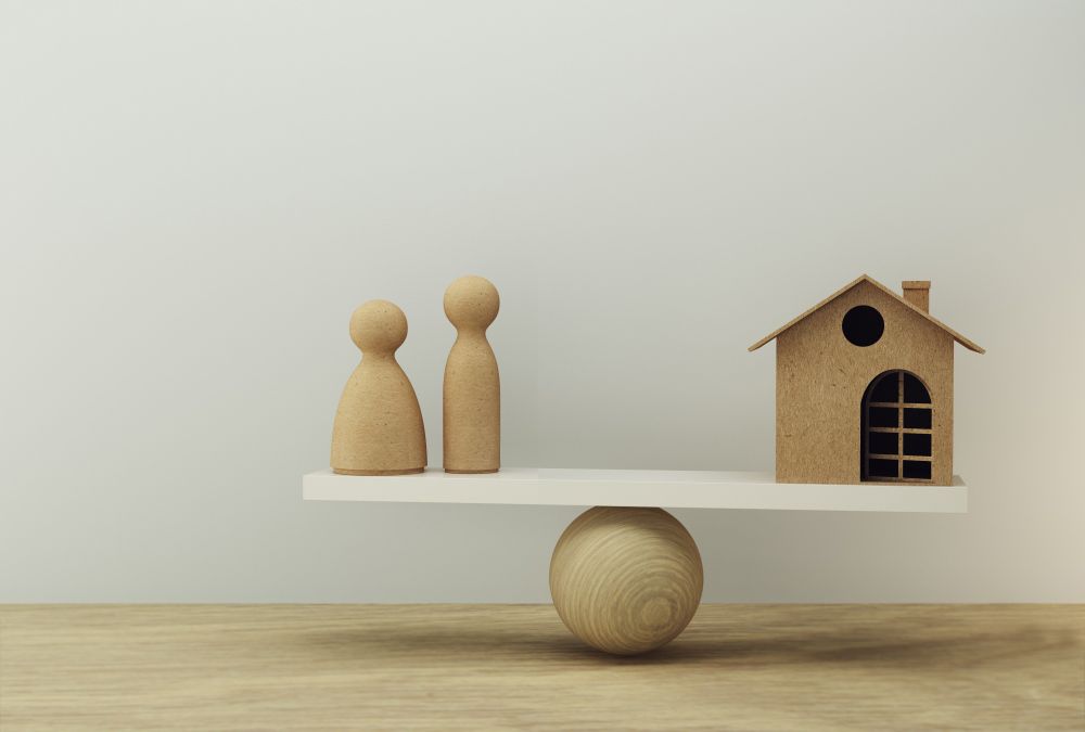 Family And House A Balance Scale In Equal Position — Property Valuations for your SMSF in Grafton, NSW