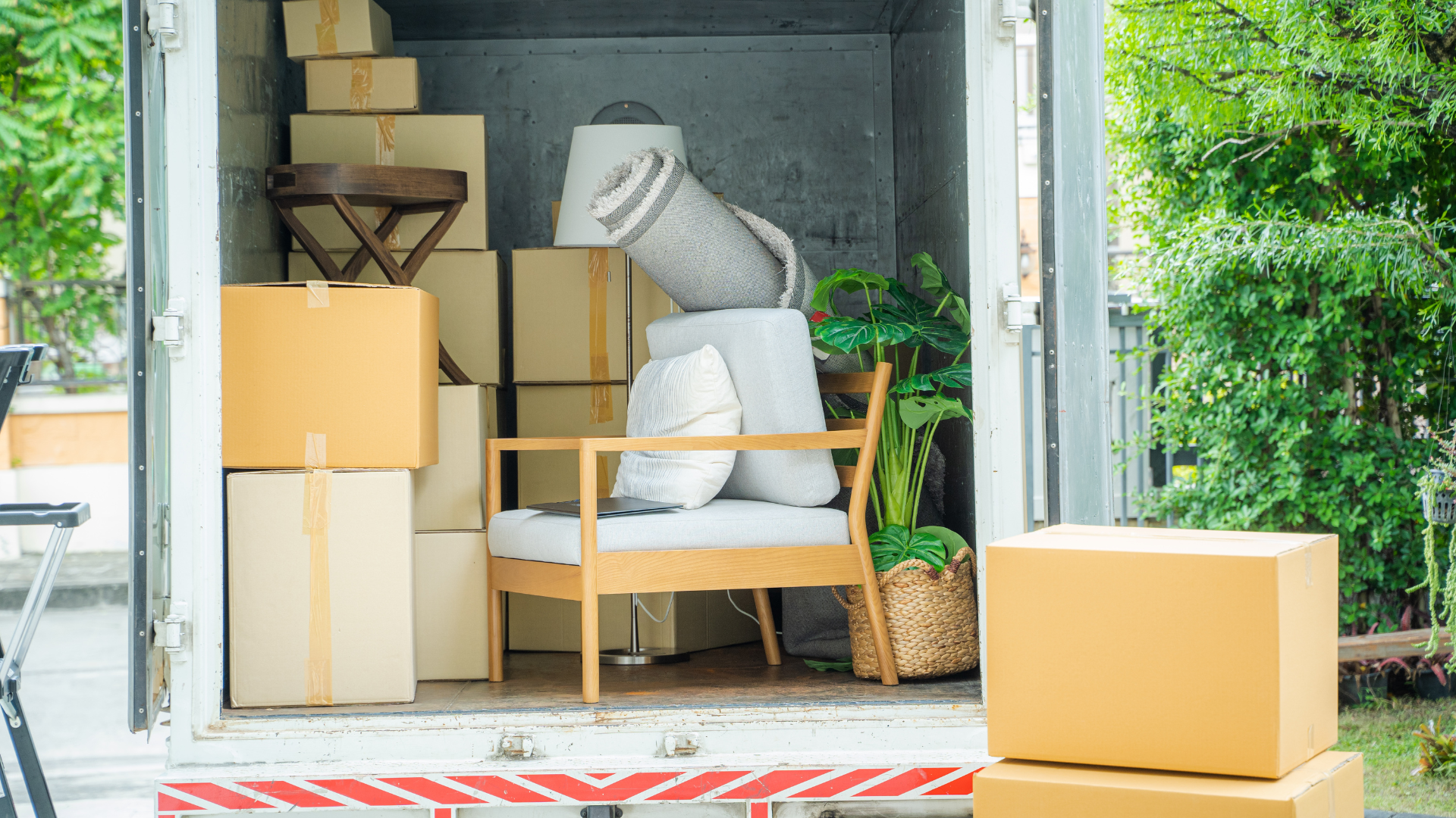 A white box with the words `` rent me '' on it is sitting in a warehouse.