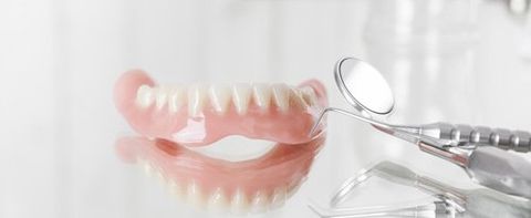 dentures with dental tools