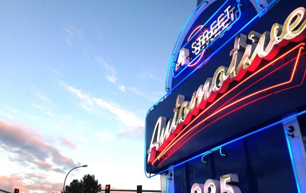 A neon sign that says automotive on it - A Street Automotive