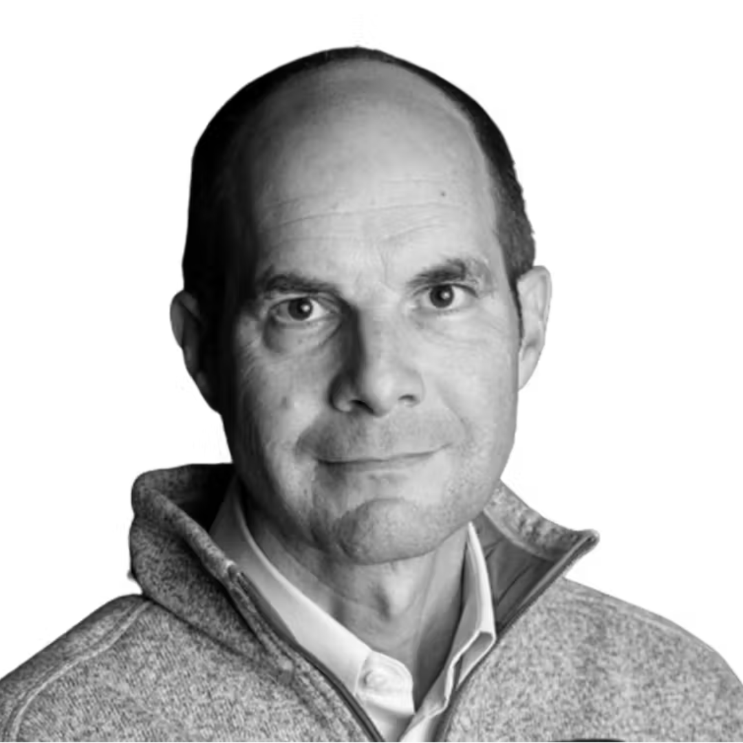 Wills Elliman wearing a grey sweater and a white shirt