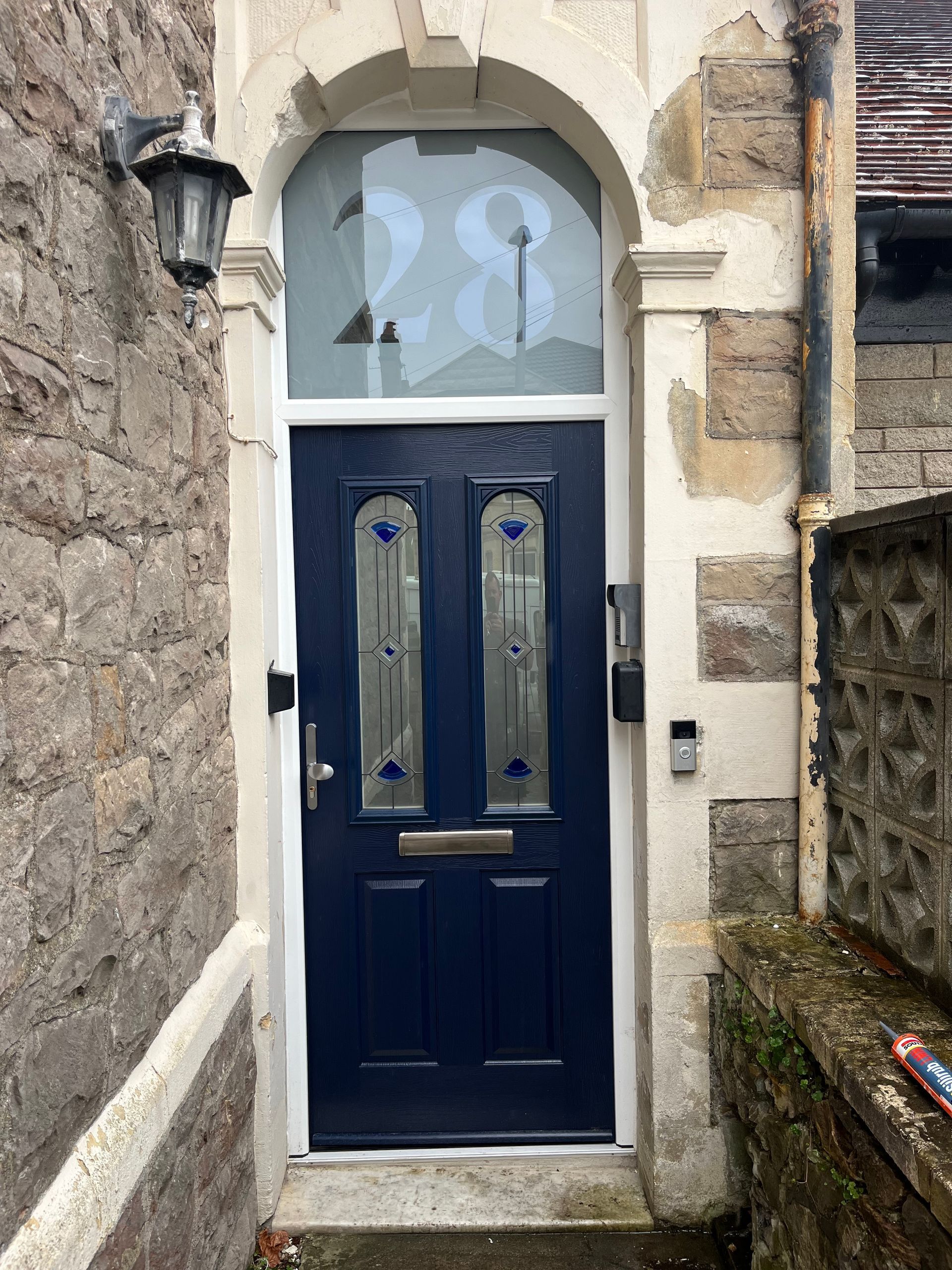 A blue door with the number 28 on it