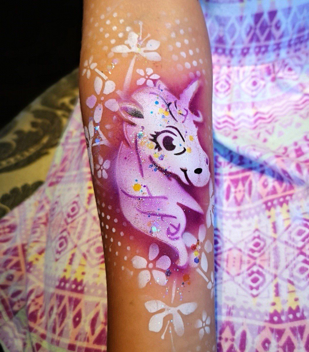 Unicorn temporary tattoo with glitter. Festival entertainment for kids and adults