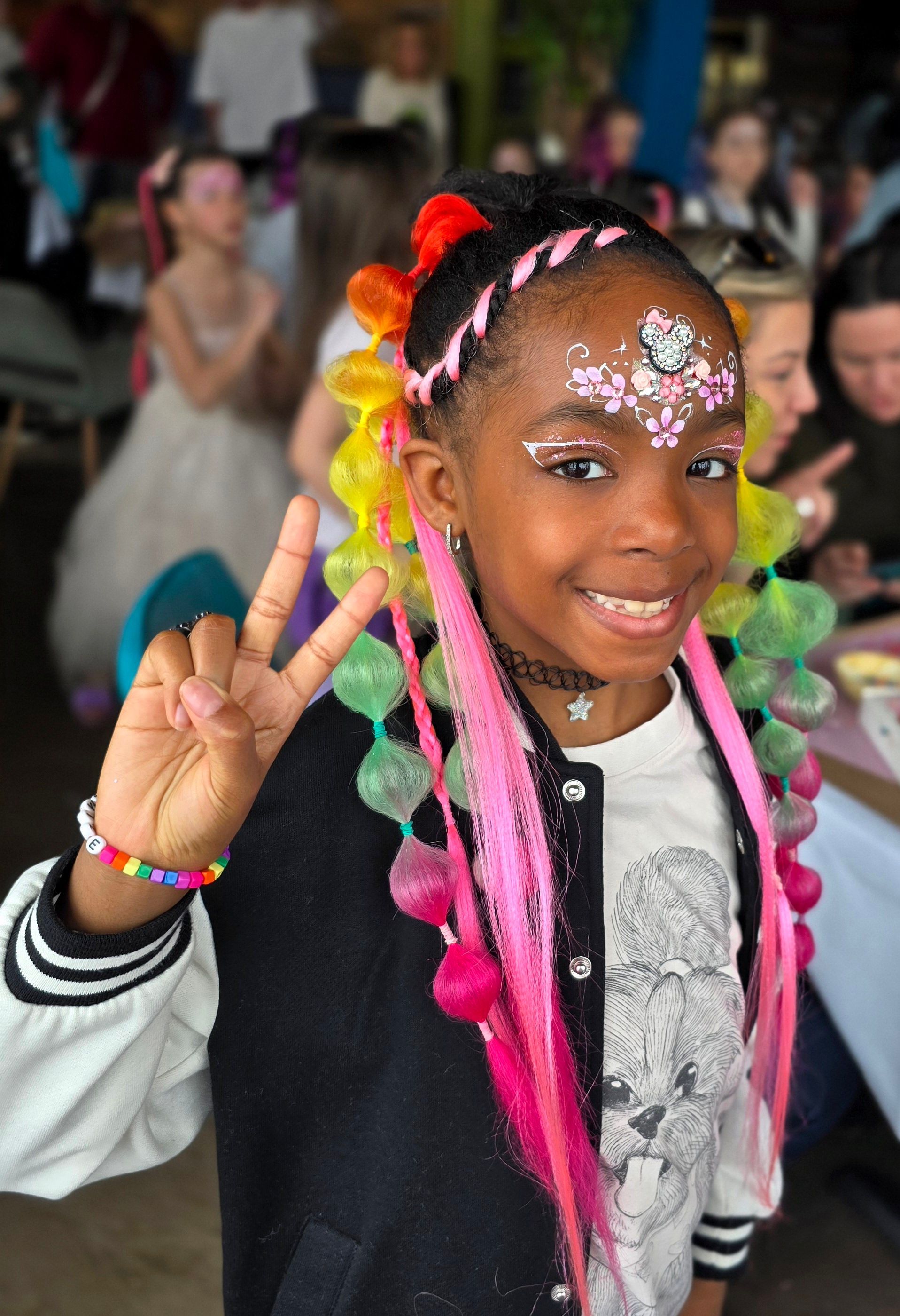 Braiding, hair extensions, face painting with gem stones