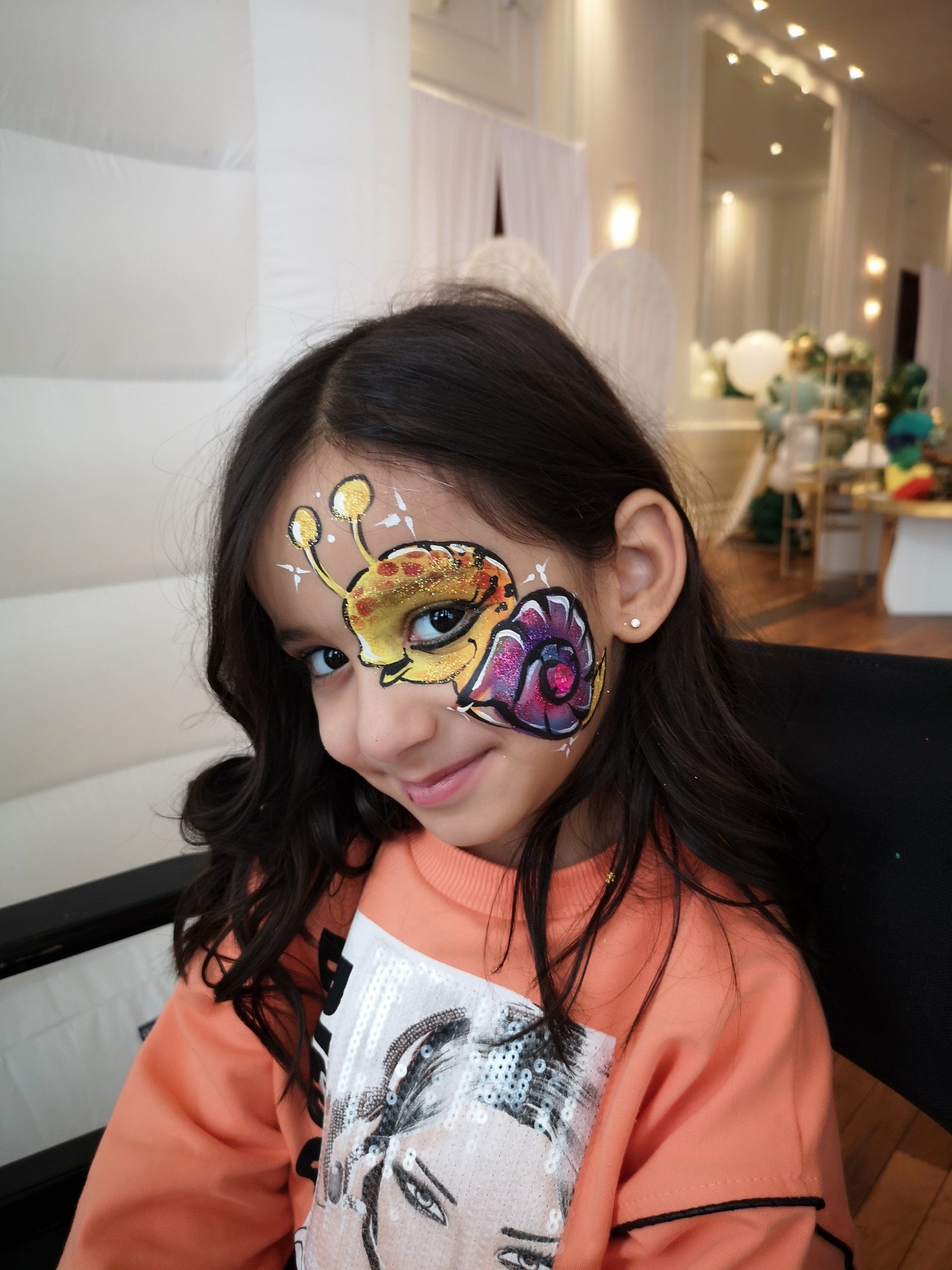 Giraffe face paint. Kids party event.