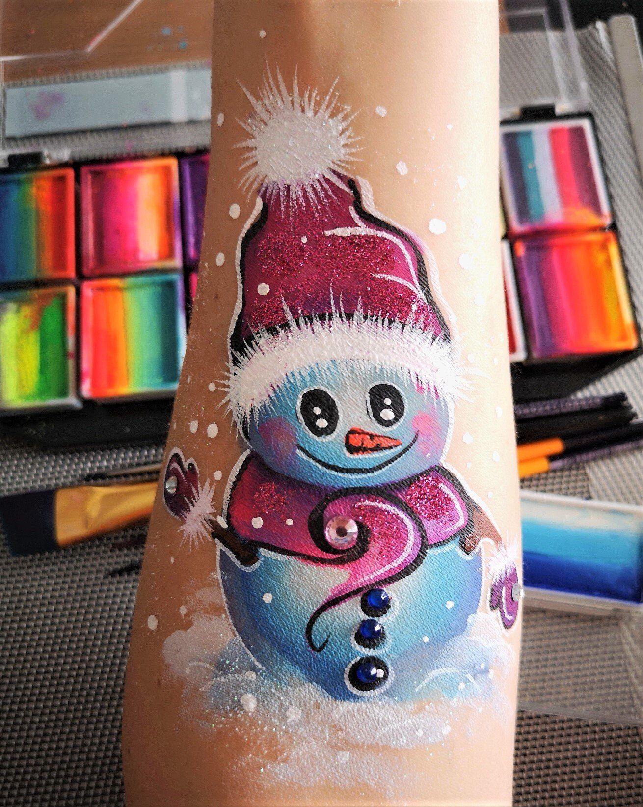 Christmas corporate event entertainment for kids and adults. Free hand paint winter design. Snow man