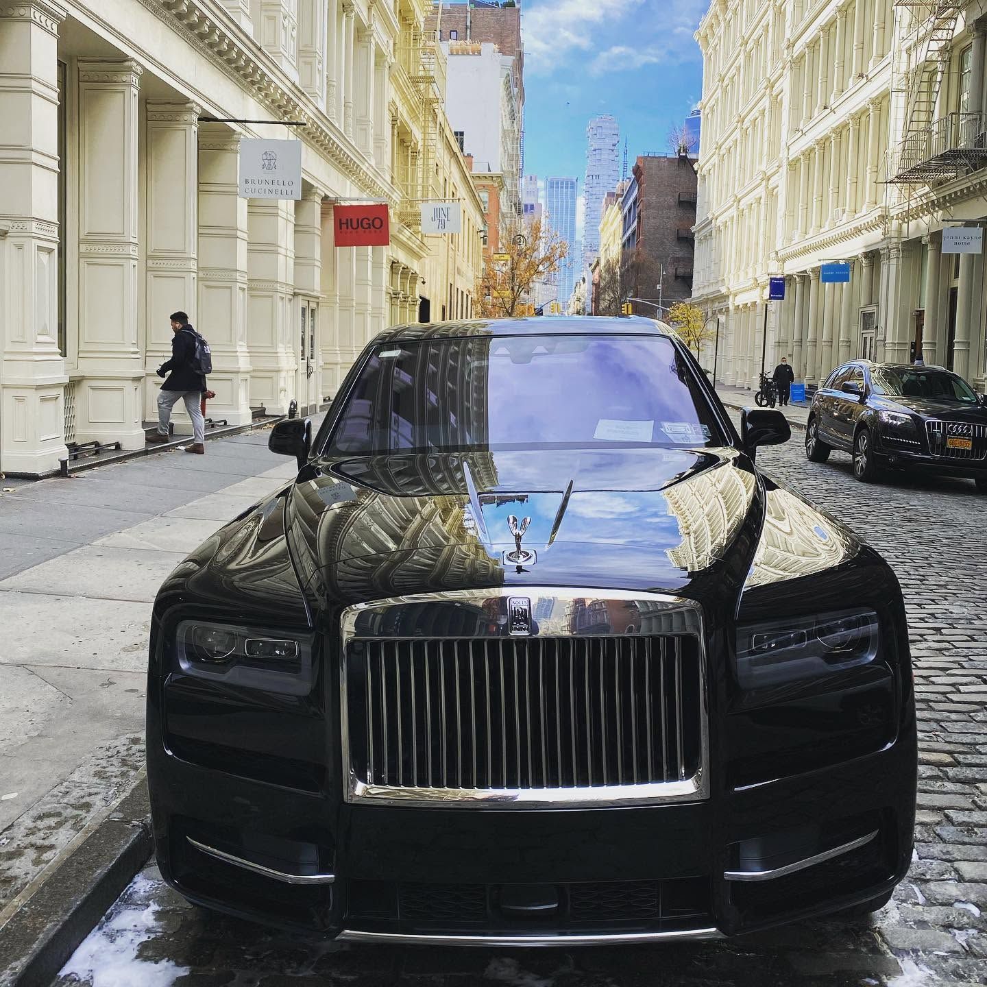 A white sports car is parked in a parking lot.