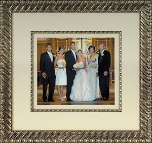 A room with a lot of paintings on the wall