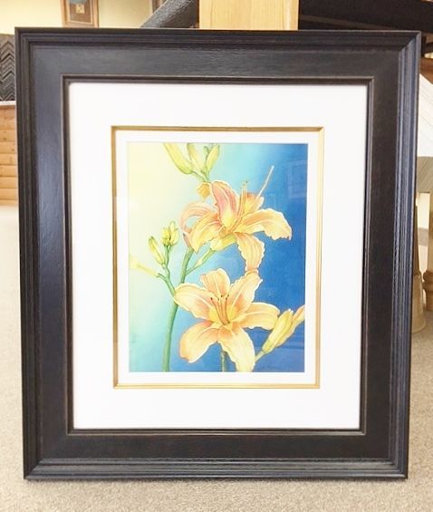 Framed art piece of flowers
