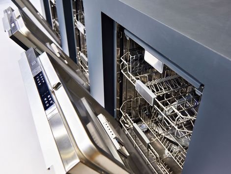 A stainless steel dishwasher with the door open