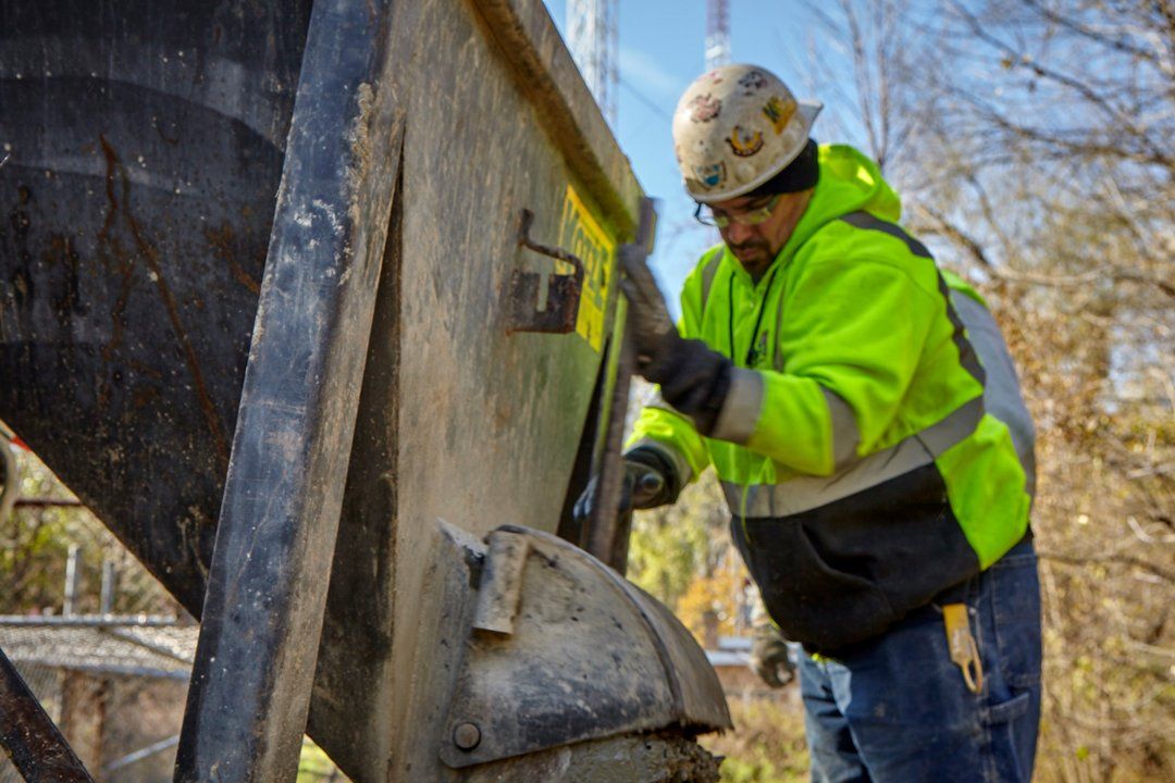 Man Creating Concrete Footings ─ Milwaukee, WI ─ Kotze Construction Co., Inc.