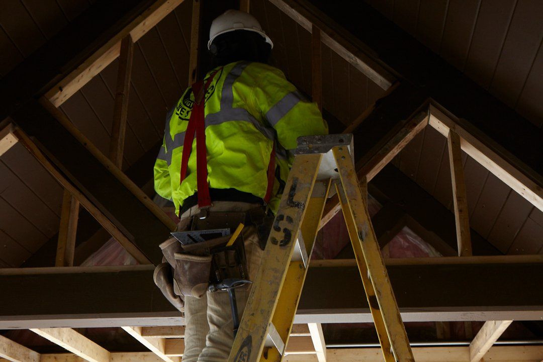 Man Renovating the Ceiling ─ Milwaukee, WI ─ Kotze Construction Co., Inc.