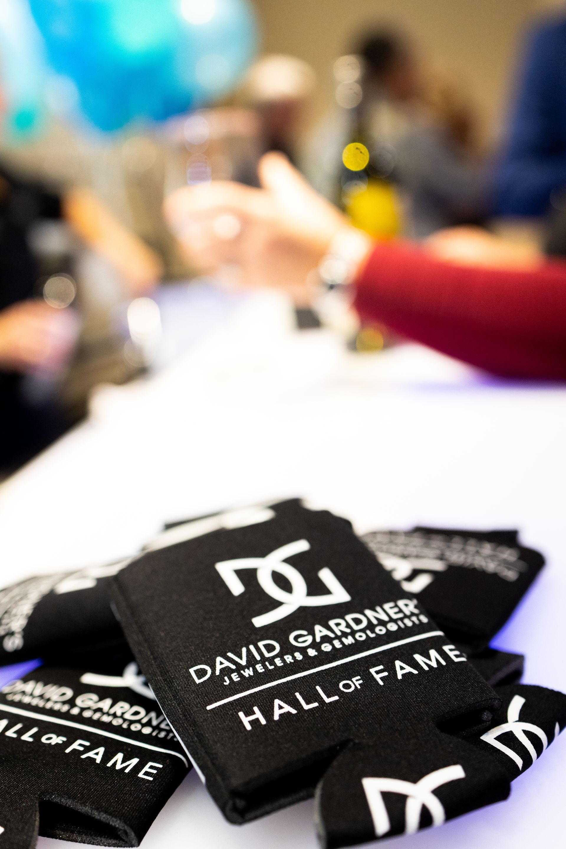 A stack of david gardner hall of fame can coolers on a table.