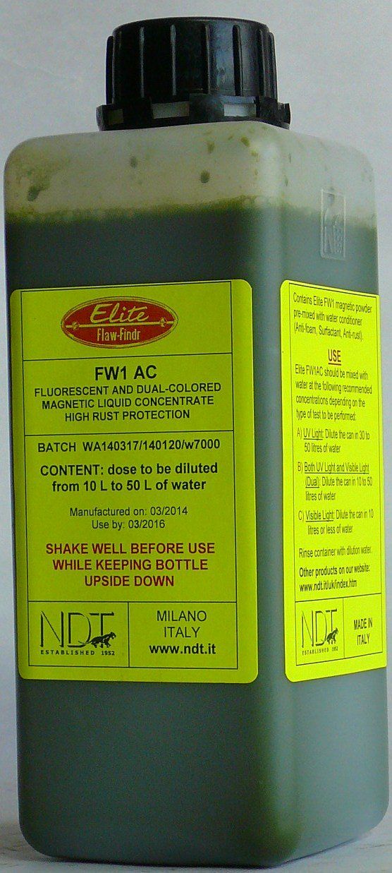 A bottle of green liquid with a yellow label on it.