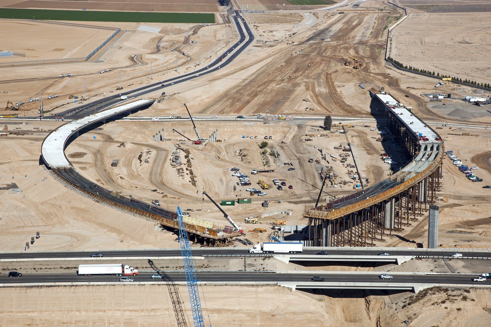 An aerial view of a bridge under construction in the desert