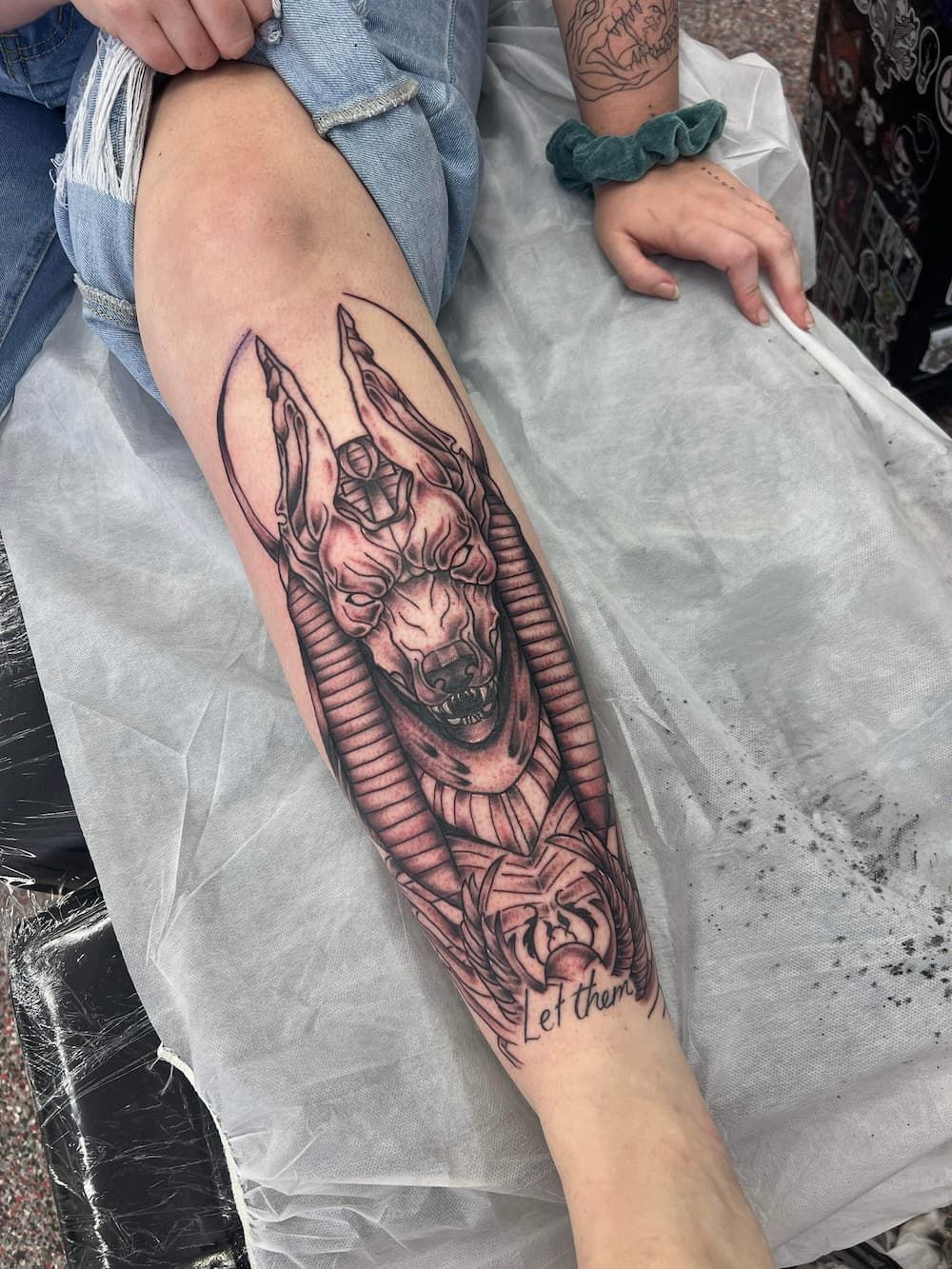 a person has a tattoo of an anubis on their leg - Tattoo Studio in Kawana, QLD