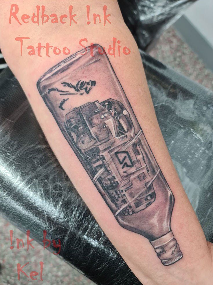 Train in Bottle Arm Tattoo - Tattoo Studio in Kawana, QLD