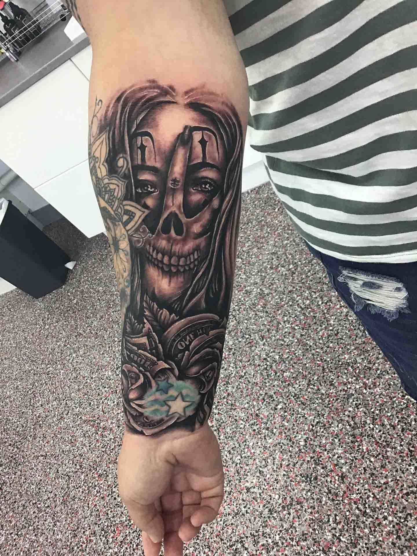 Face and Skull Tattoo on Arm - Tattoo Studio in Kawana, QLD