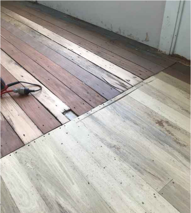 Sanding a floor and repairing— Restorations & Repairs in Cairns