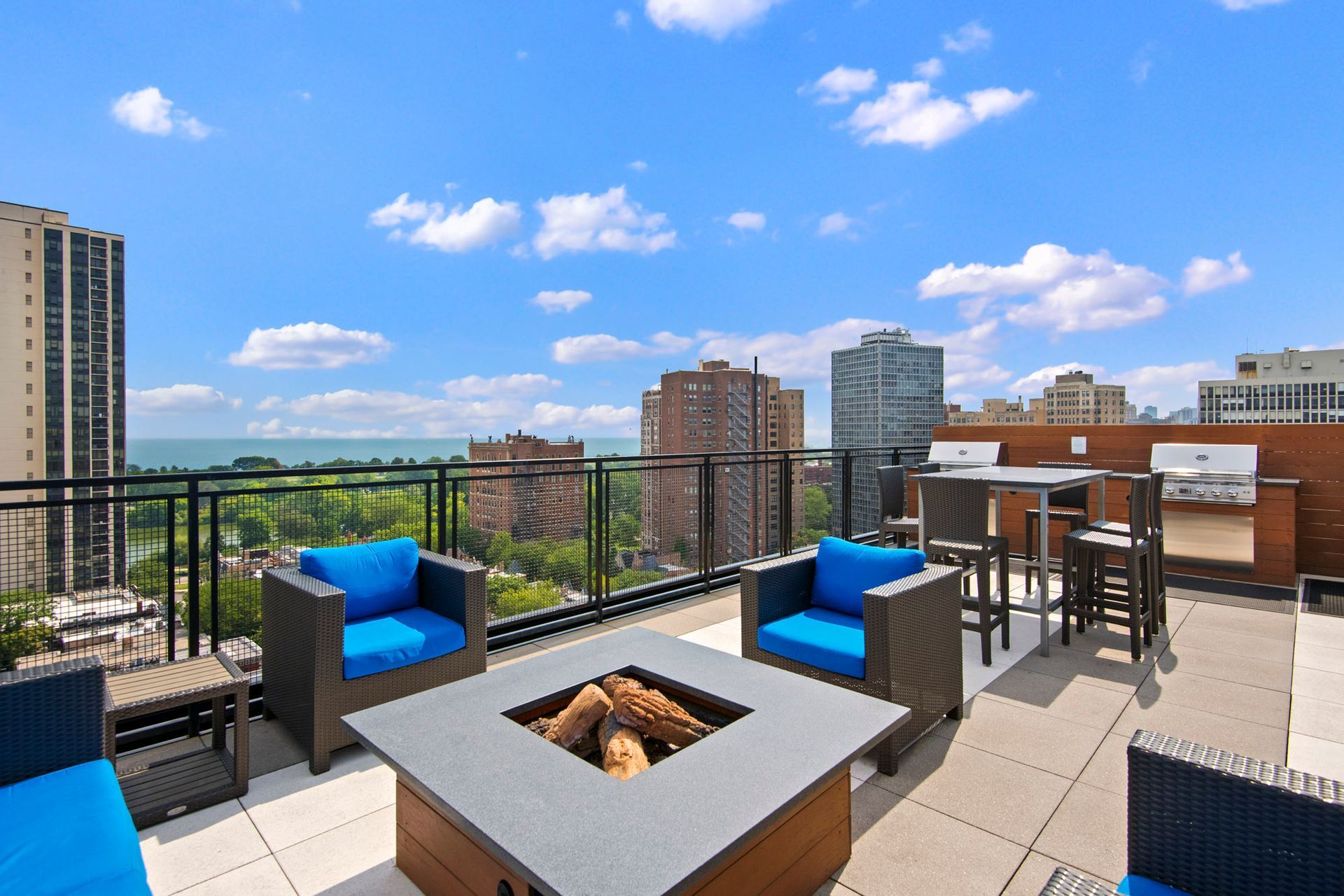 Rooftop lounge with fireplace at Park Lincoln by Reside.