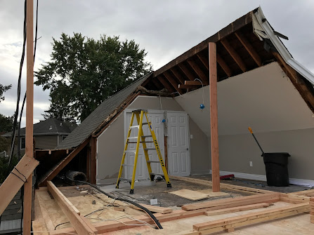 A ladder is sitting in the attic of a house under construction.