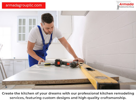 A man is working on a kitchen with a drill and a level.