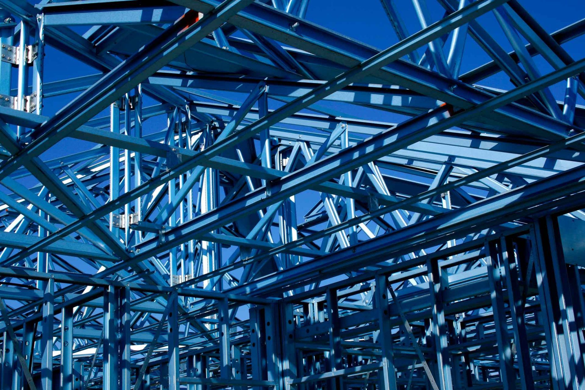 A building under construction with a blue sky in the background