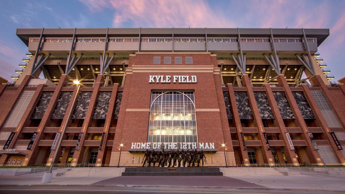 A large brick building with kyle field written on it