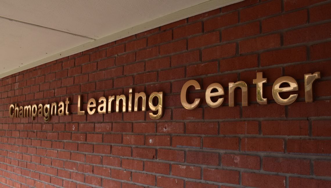 A brick wall with the word learning center on it