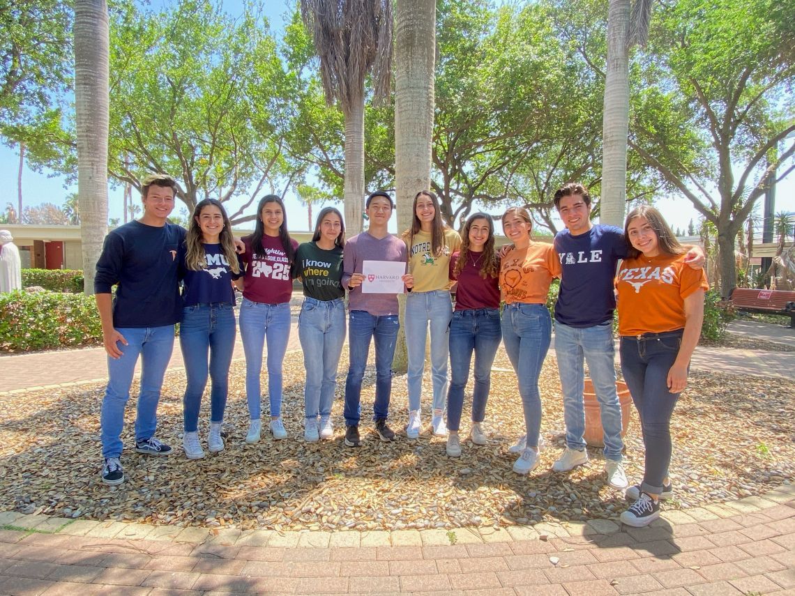 A group of people posing for a picture with one girl wearing a shirt that says texas
