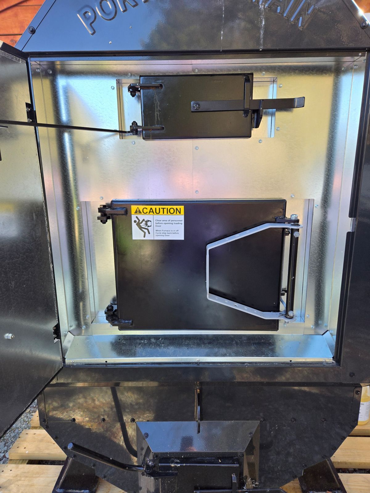 two stage locking door on woodstove fire box