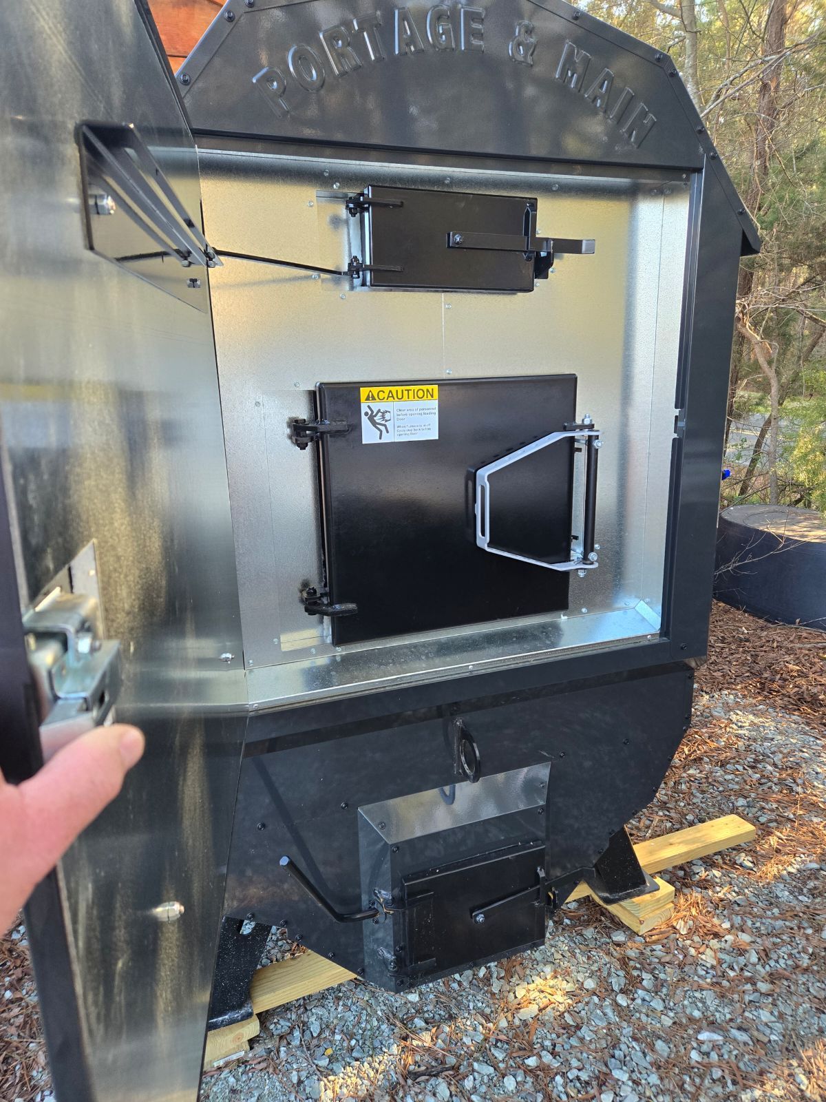 inner doors of the woodstove are protected from the elements by the insulated exterior  door