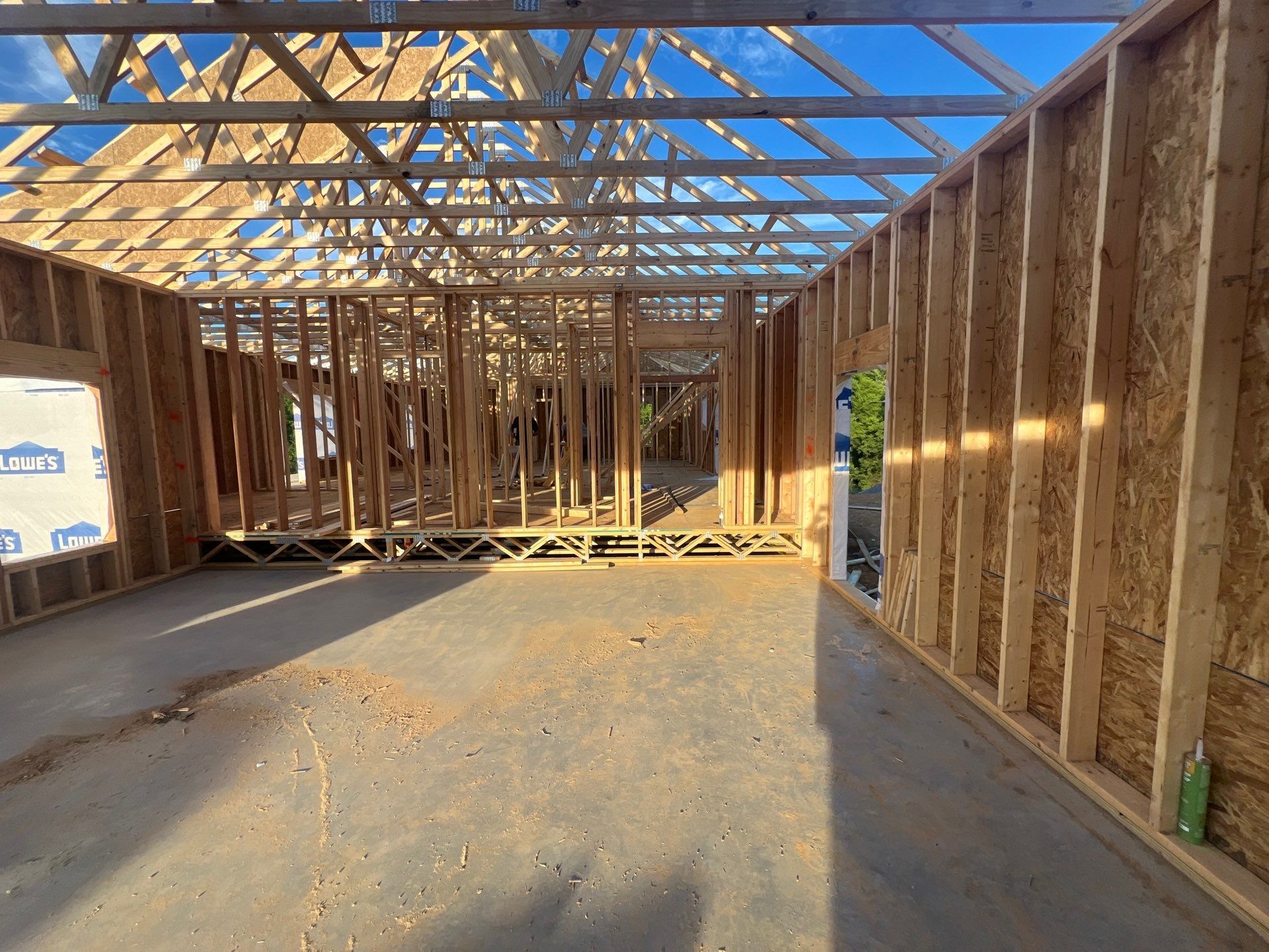 A house is being built with a lot of wooden beams.