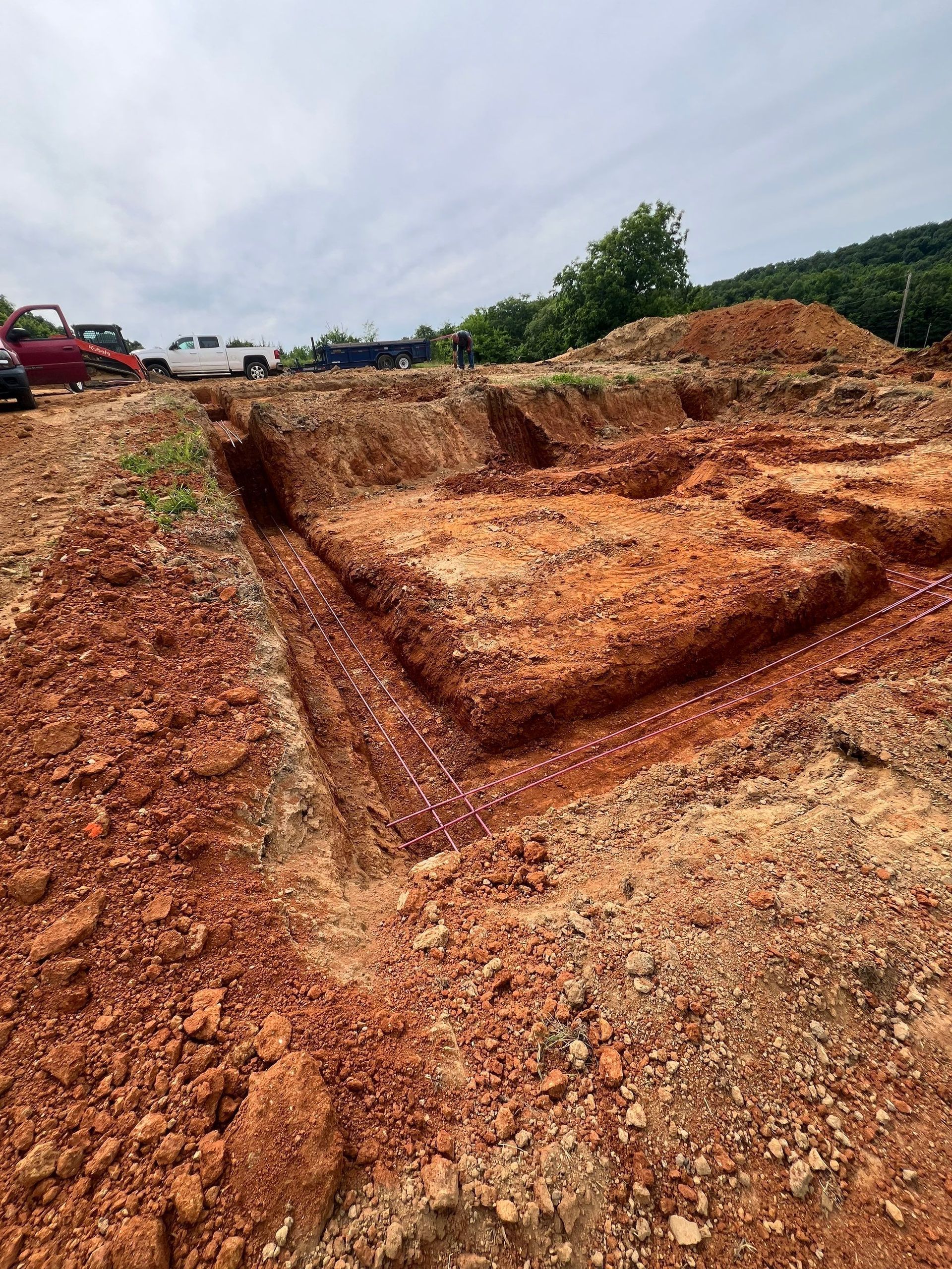 A large pile of dirt is sitting on top of a dirt field.