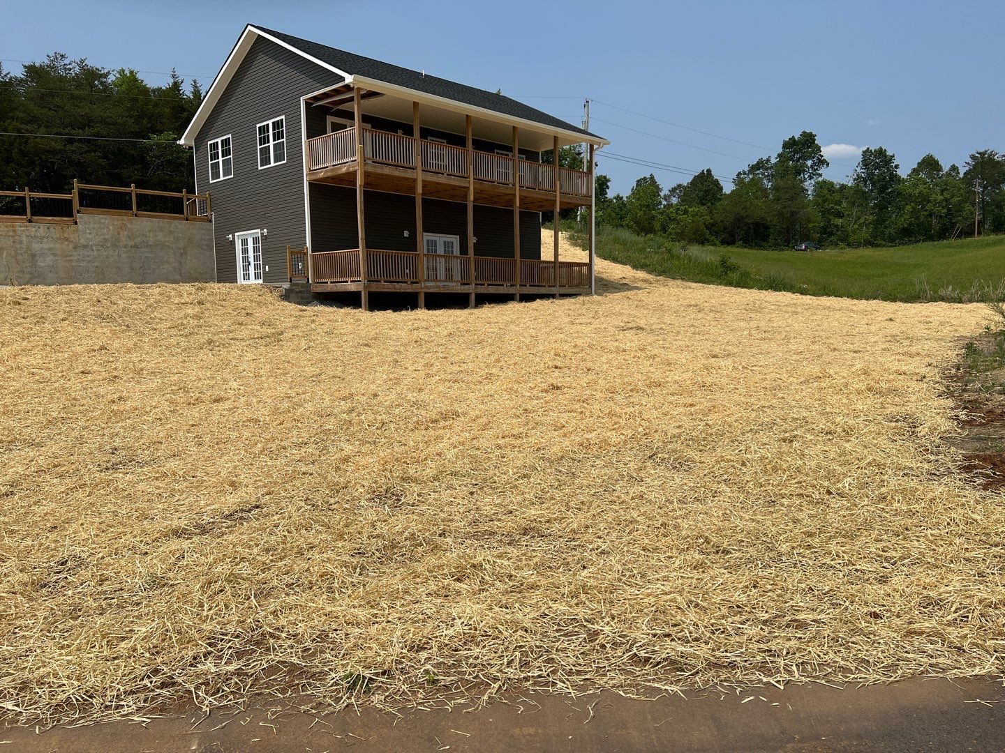 A house with a lot of grass in front of it