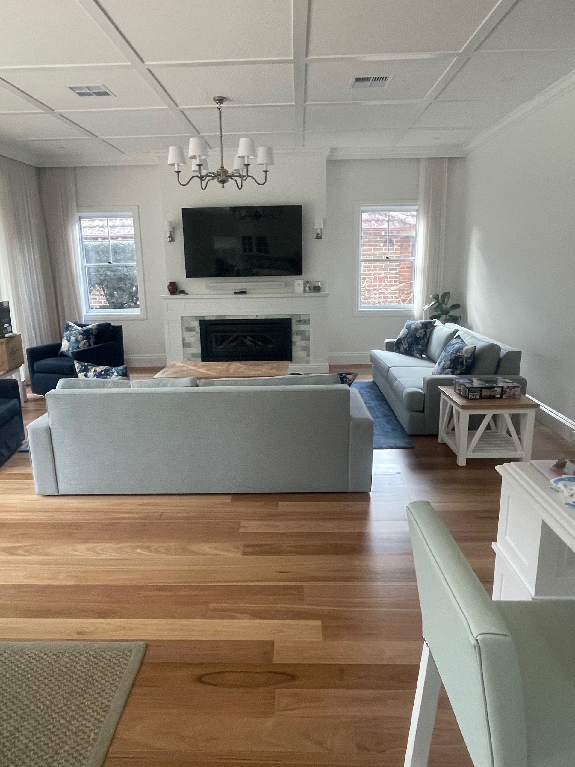 A living room filled with furniture and a flat screen tv