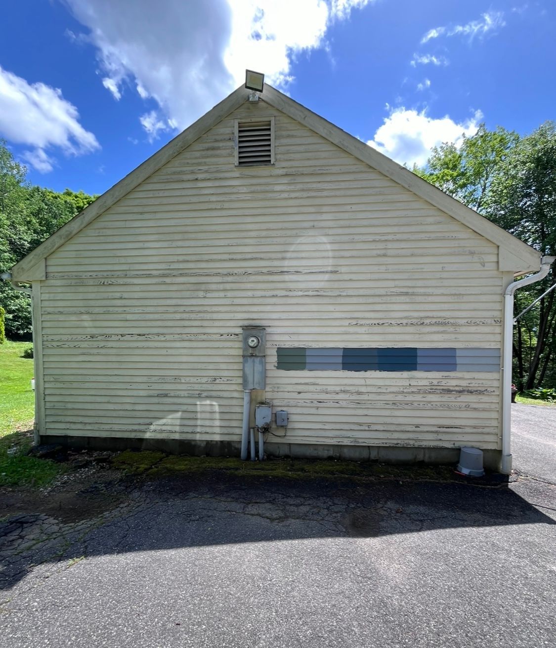 A white house with a blue sky in the background