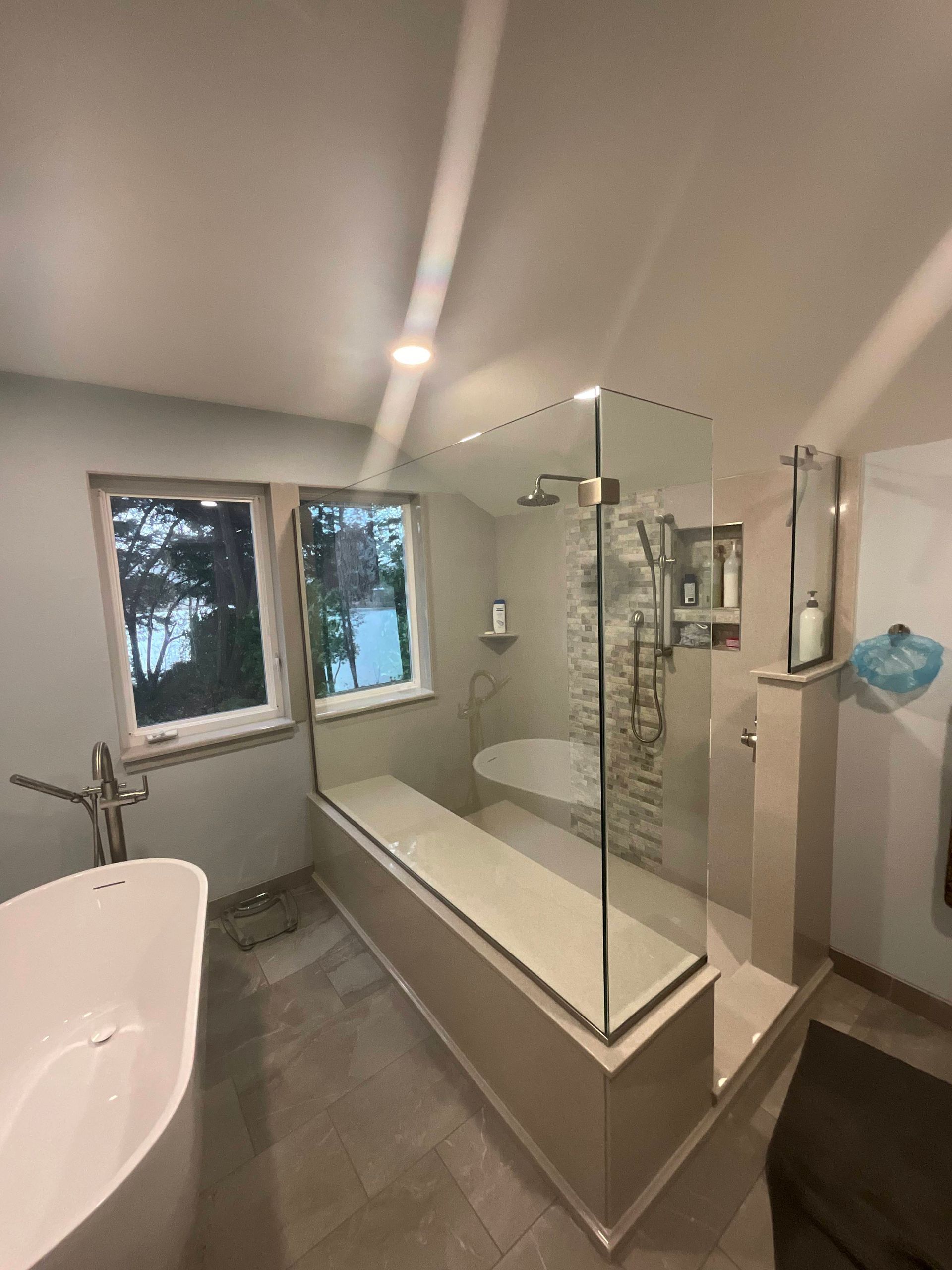 A bathroom with a sink and a large mirror