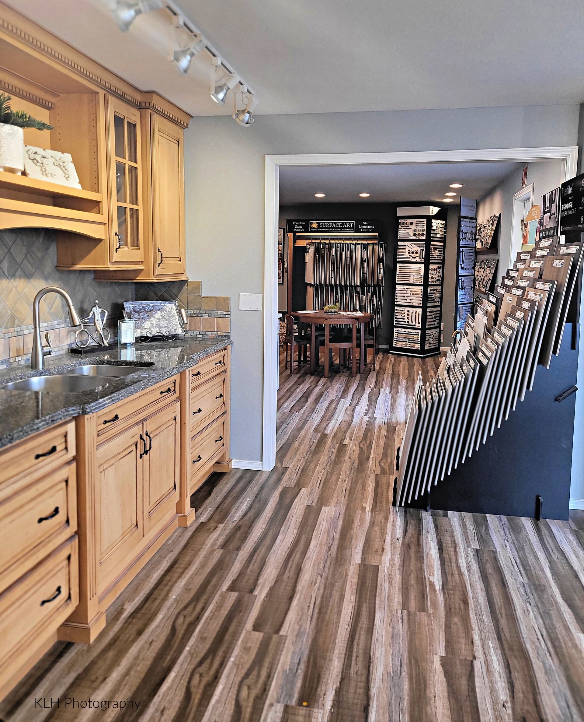 A kitchen with wooden cabinets and granite counter tops